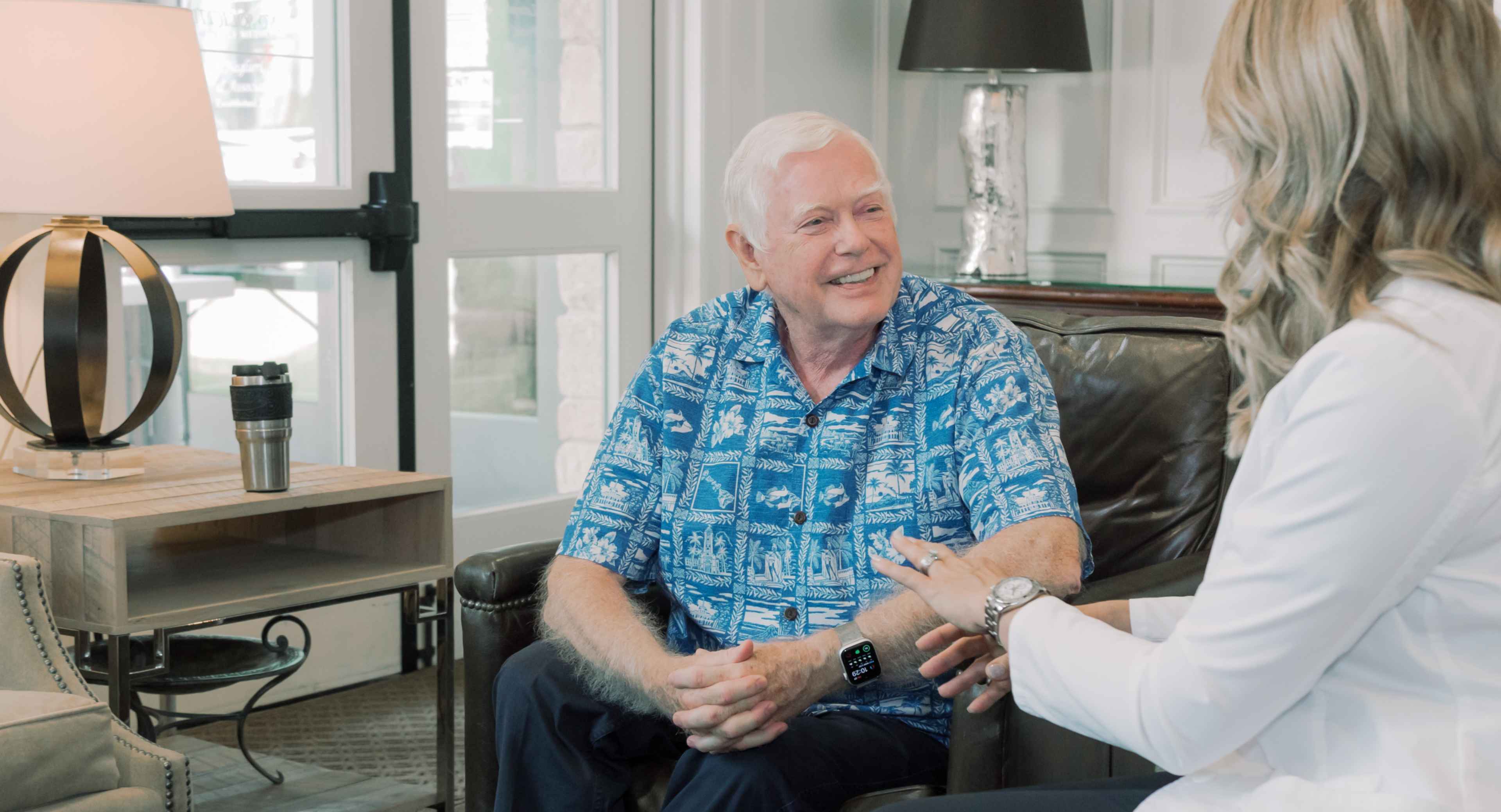 Photo of a patient talking with a dentist