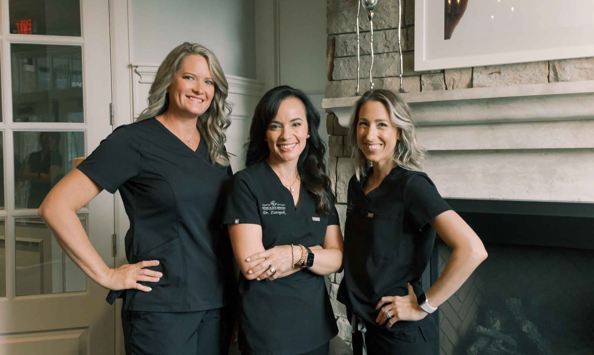 Three dentists standing next to eachother